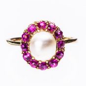 A CULTURED PEARL AND RUBY RING