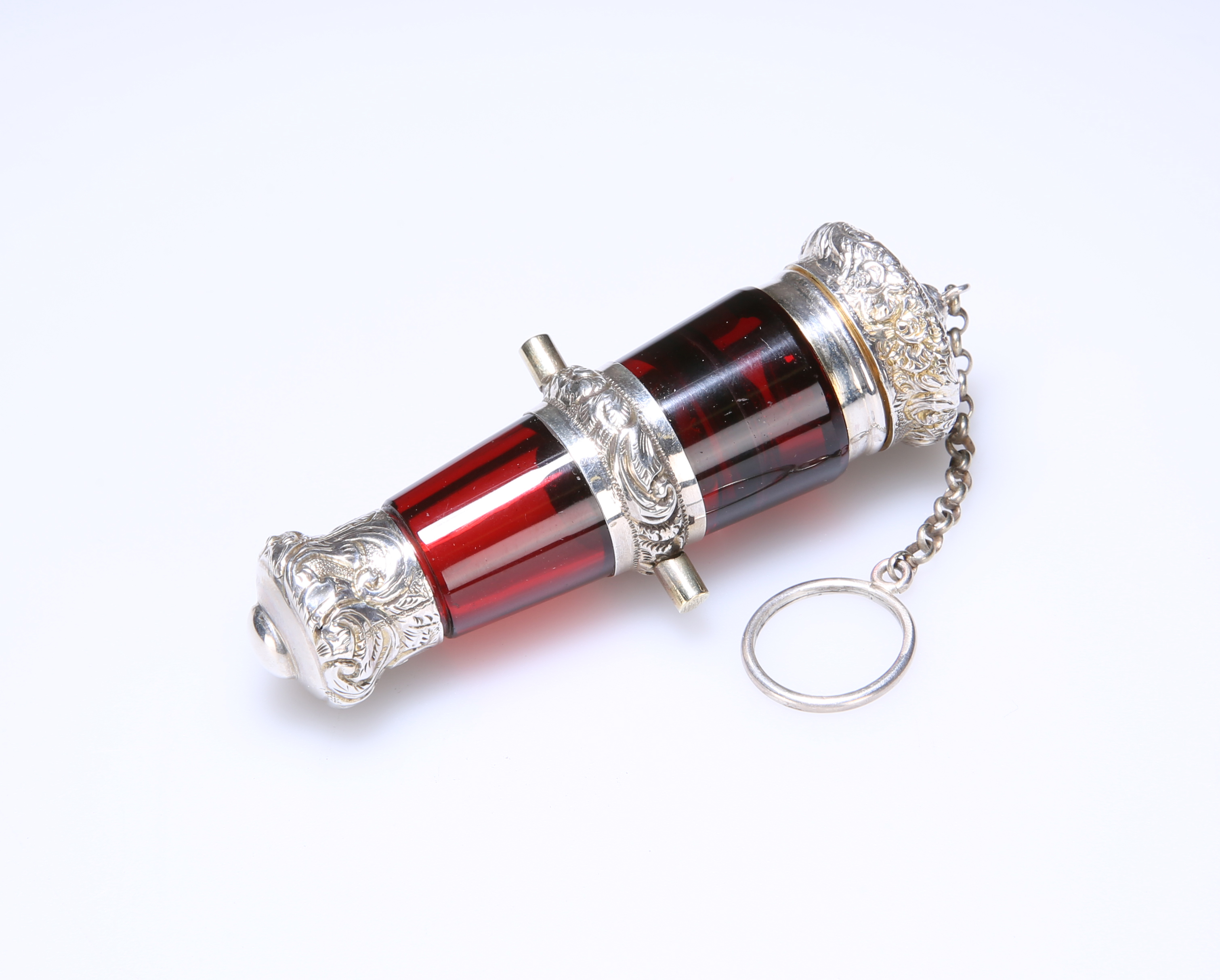 A FINE VICTORIAN SILVER (TESTED) MOUNTED RUBY GLASS CANNON-SHAPED SCENT BOTTLE/VINAIGRETTE