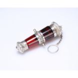 A FINE VICTORIAN SILVER (TESTED) MOUNTED RUBY GLASS CANNON-SHAPED SCENT BOTTLE/VINAIGRETTE