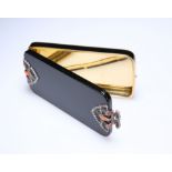 A DIAMOND AND CORAL SET GOLD AND ENAMEL COMPACT IN THE ART DECO TASTE