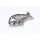 AN UNUSUAL WHITE METAL VESTA CASE, IN THE FORM OF A FISH