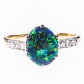 A BLACK OPAL AND DIAMOND RING