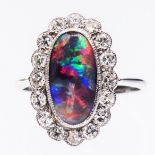 A PLATINUM, BLACK OPAL AND DIAMOND RING