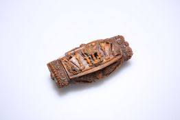 A 19th CENTURY CARVED COQUILLA NUT SNUFF BOX