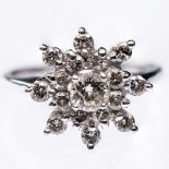 A 14CT WHITE GOLD AND DIAMOND CLUSTER RING