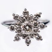 A 14CT WHITE GOLD AND DIAMOND CLUSTER RING
