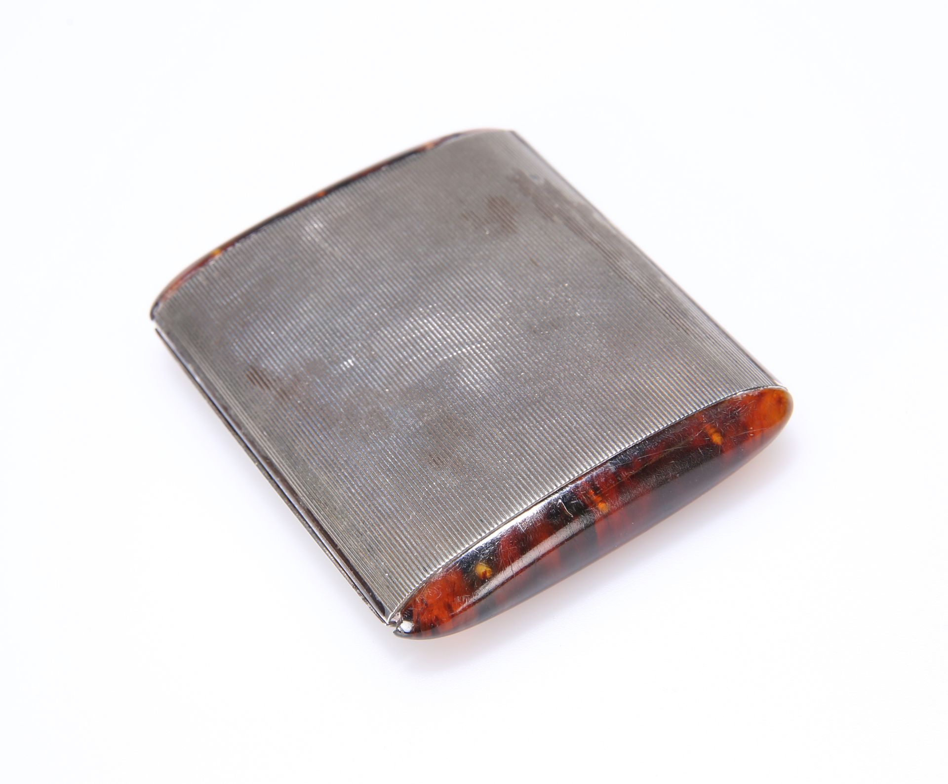 AN ART DECO SILVER AND TORTOISESHELL COMPACT