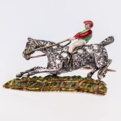 A MID 19TH CENTURY DIAMOND AND ENAMEL JOCKEY AND HORSE BROOCH