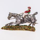 A MID 19TH CENTURY DIAMOND AND ENAMEL JOCKEY AND HORSE BROOCH