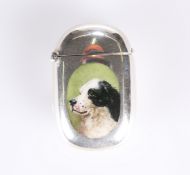 A LATE VICTORIAN SILVER AND ENAMEL VESTA CASE DECORATED WITH A SPANIEL'S HEAD
