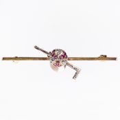 A DIAMOND AND RUBY SET BROOCH