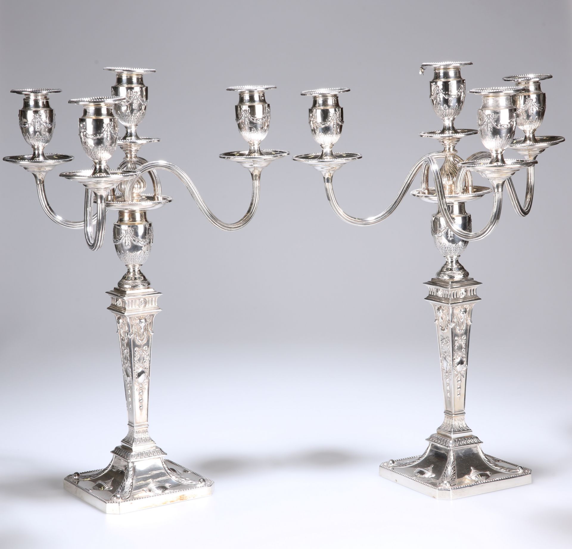 A HANDSOME PAIR OF VICTORIAN FOUR-LIGHT SILVER CANDELABRA IN THE ADAM REVIVAL TASTE