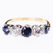 A SAPPHIRE AND DIAMOND RING