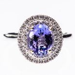 AN 18CT WHITE GOLD TANZANITE AND DIAMOND RING