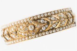 A VICTORIAN SEED PEARL AND DIAMOND BANGLE