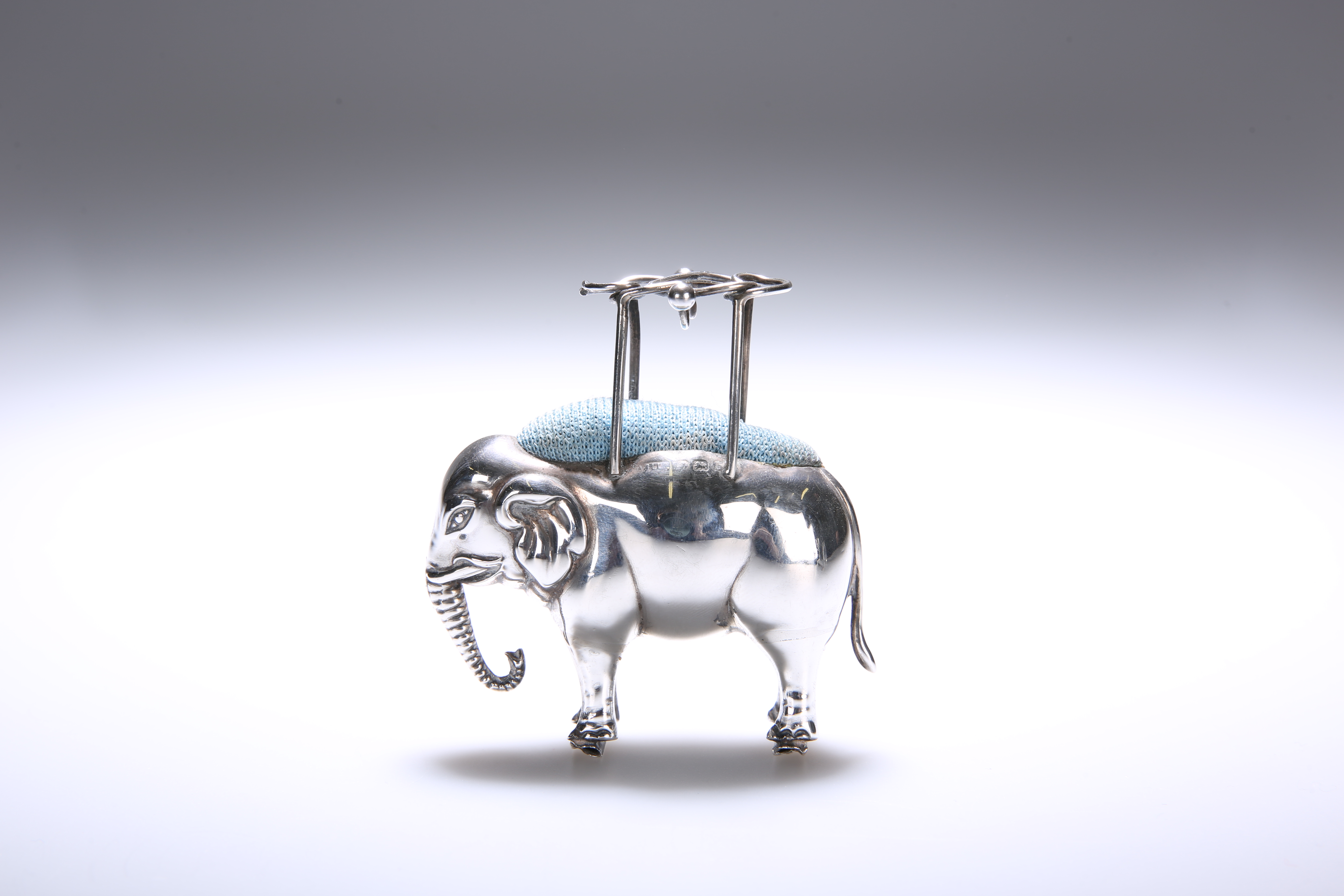 AN EDWARDIAN SILVER ELEPHANT FORM PIN CUSHION, ADIE & LOVEKIN, BIRMINGHAM 1901