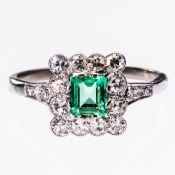 AN EMERALD AND DIAMOND RING