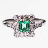 AN EMERALD AND DIAMOND RING