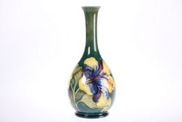 A WALTER MOORCROFT POTTERY BOTTLE SHAPED VASE