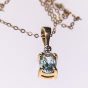 AN AQUAMARINE AND DIAMOND PENDANT