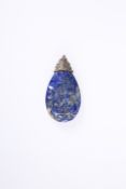 A CARVED LAPIS LAZULI PENDANT