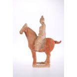 A CHINESE POTTERY HORSE AND RIDER, TANG