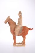 A CHINESE POTTERY HORSE AND RIDER, TANG