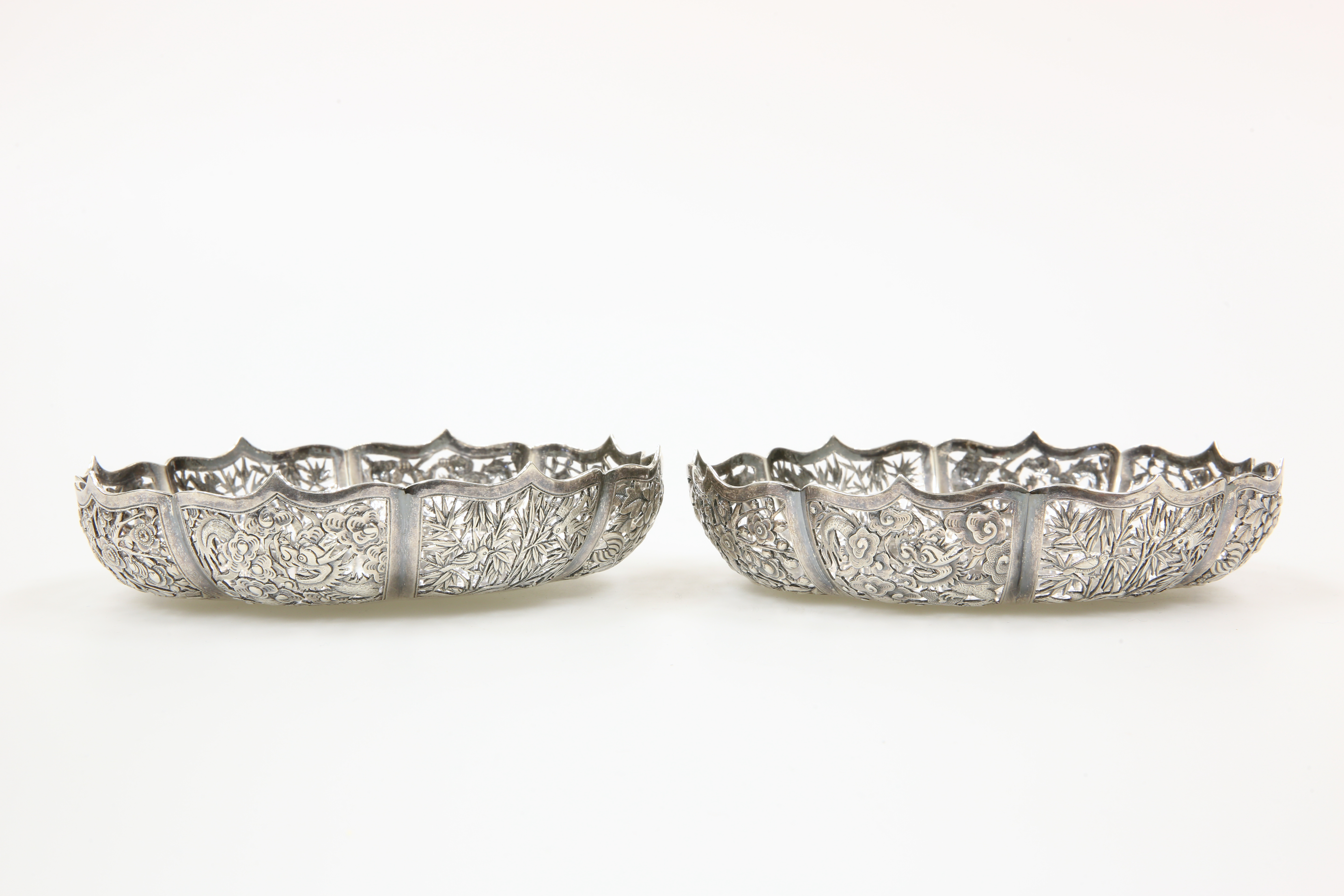 A PAIR OF CHINESE PIERCED SILVER BOWLS, C.1900