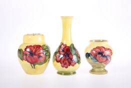 THREE PIECES OF MOORCROFT POTTERY IN THE HIBISCUS PATTERN