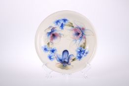 A MOORCROFT SALT-GLAZED PLATE