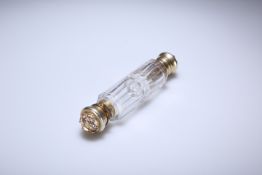 A MID-VICTORIAN SILVER-GILT MOUNTED CUT-GLASS DOUBLE-ENDED SCENT BOTTLE RETAILED BY ASPREY & CO.