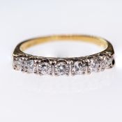 AN 18CT YELLOW GOLD AND DIAMOND RING