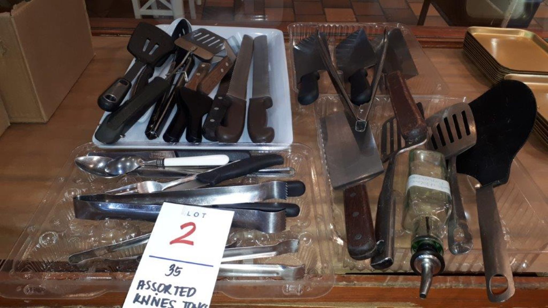 Assorted knives,tongs,spatula,etc...