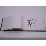Autograph: An autograph album - numbered 201 containing circa 95 signatures collected in person by