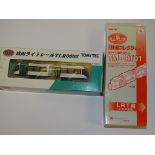 A TOMYTEC N GAUGE JAPANESE OUTLINE 2 PART ARTICULATED TRAM (non powered) together with the