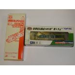 A TOMYTEC N GAUGE JAPANESE OUTLINE 3 PART ARTICULATED TRAM (non powered) together with the