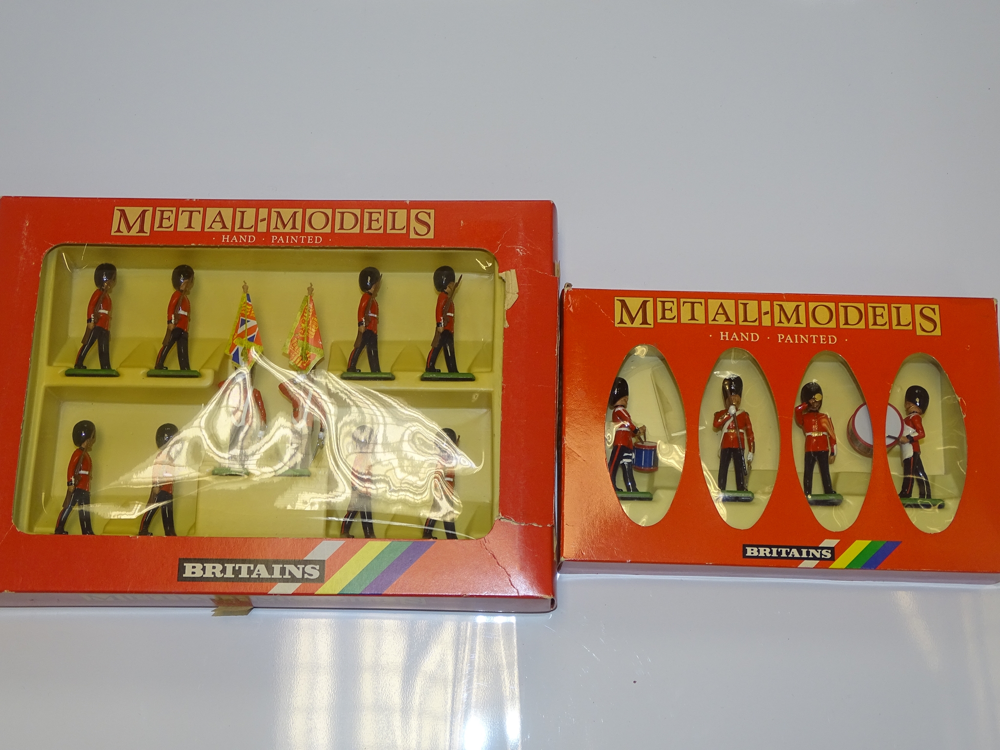 A PAIR OF BRITAINS METAL MODELS SOLDIER SETS to include 7210 SCOTS GUARDS DRUM and BUGLE SET and