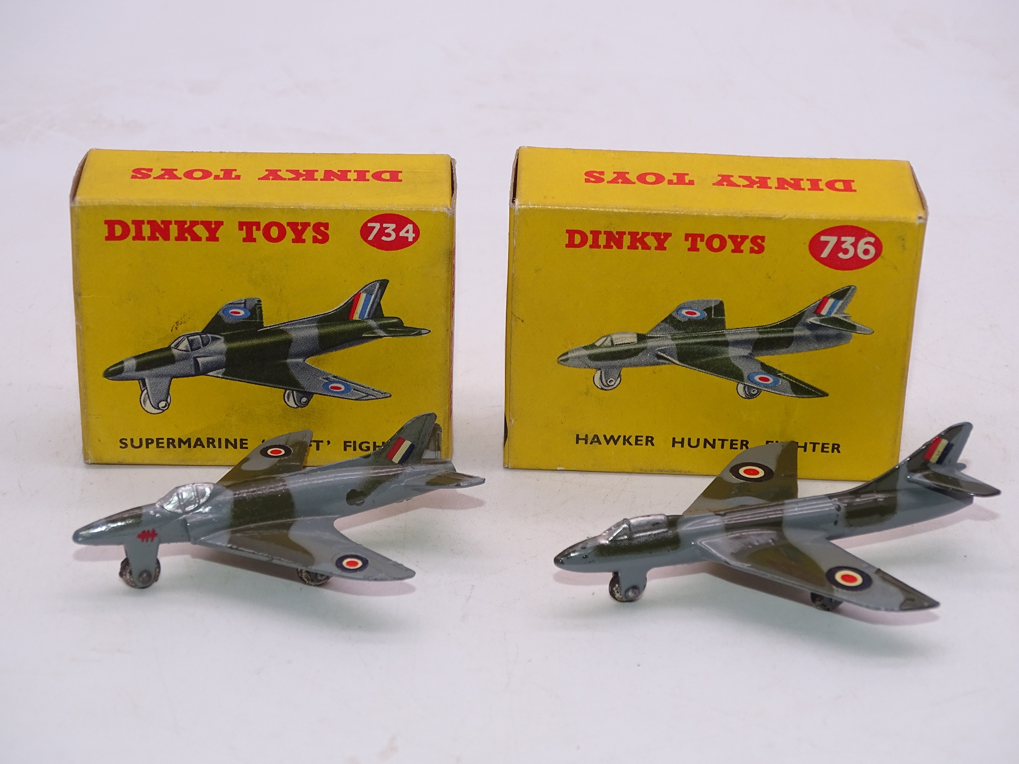 A PAIR OF VINTAGE DINKY AIRCRAFT TO INCLUDE: A 734 'SUPERMARINE SWIFT' AND A 736 'HAWKER HUNTER' -