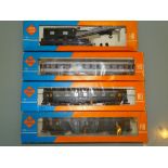 HO GAUGE - A group of Roco coaches and a crane in