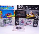 A group of Corgi Classics "The Beatles Collection" diecast vehicles together with a brochure for the