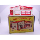 A Matchbox MF-1 Fire Station, with red roof and red doors and frontage. G-VG in generally G box.
