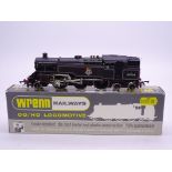 A Wrenn W2218A Class 4MT 2-6-4 standard tank in BR black numbered 80064. VG-E in a VG hand