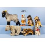 Konv. 7 Steiff Tiere, dabei Bär, Hase, Frischling, Igel, Heidschnucke, Löwe und Ente,