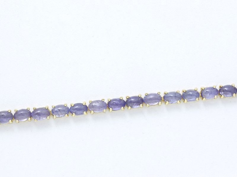 Bracelet articulé en vermeil 800 millièmes, orné d'une ligne de cabochons de [...]