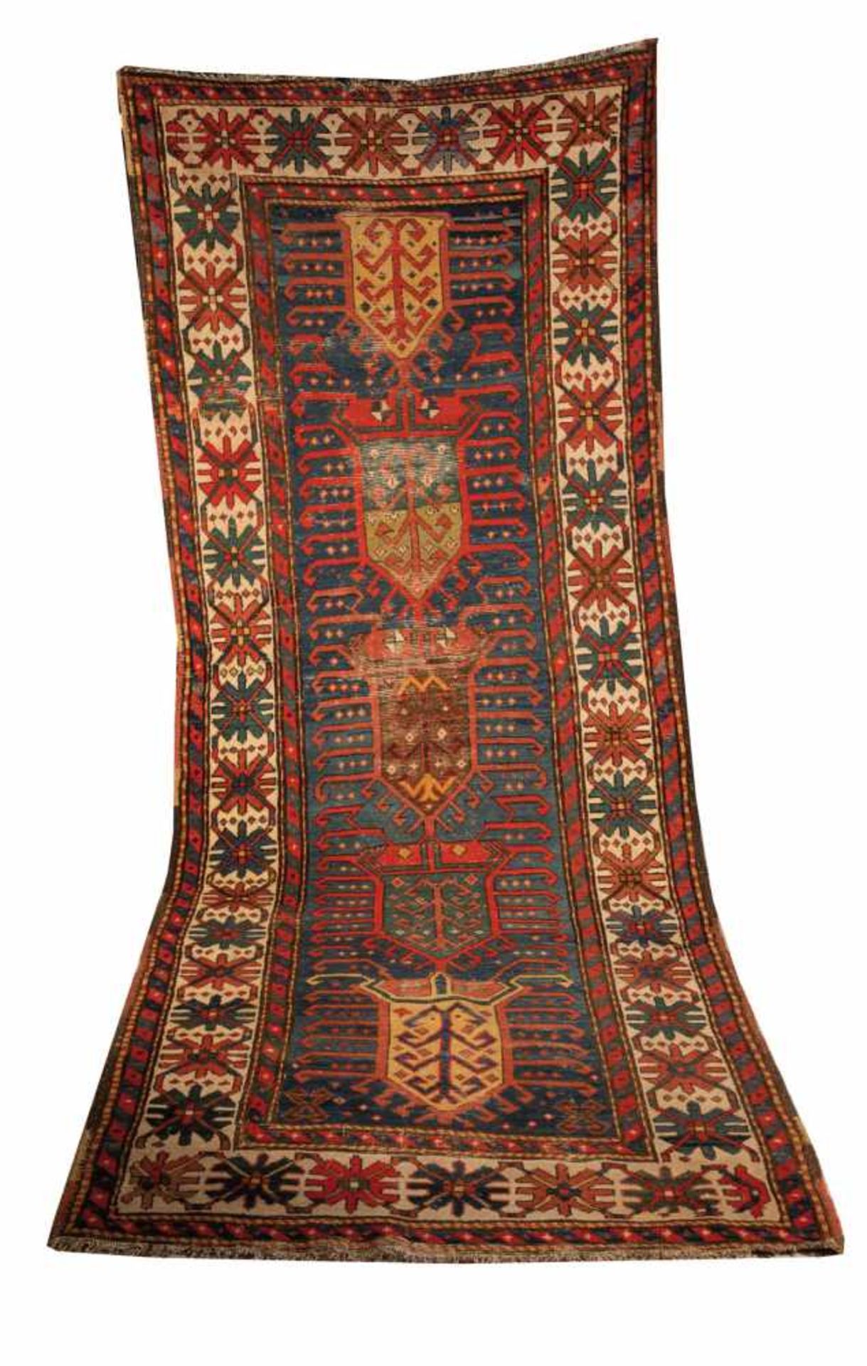 A ''Kazak'' carpet. Caucasus, late 19th century. Five stylized tree of live fields on blueground.