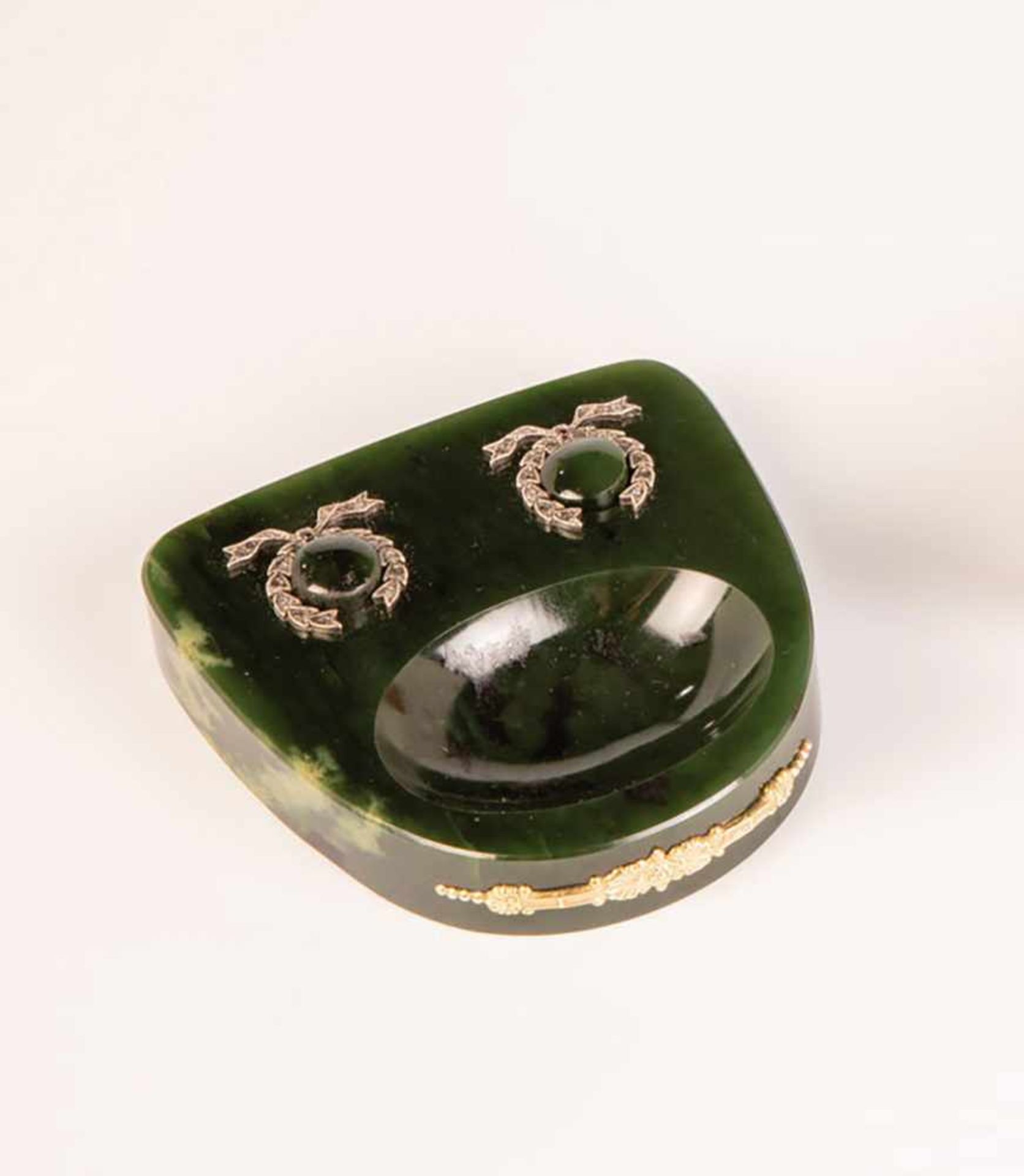 A nephrite desk bell set with diamond roses. 20th century. Front with silver-gilt decor.Two