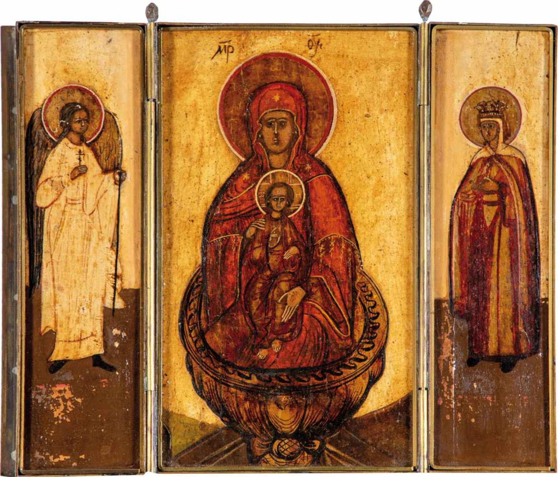 A travelling triptych icon. Russia, circa 1800. Tempera on gesso on three wood panels.Brass frame.