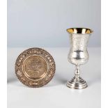 A silver judaica beaker and small plate. Circa 1880. Beaker with engraved decor, stampedwith 84-