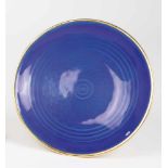 A silver-gilt and guilloché enamel bowl. 2nd half of the 20th century. Round stand. Bowlwith blue