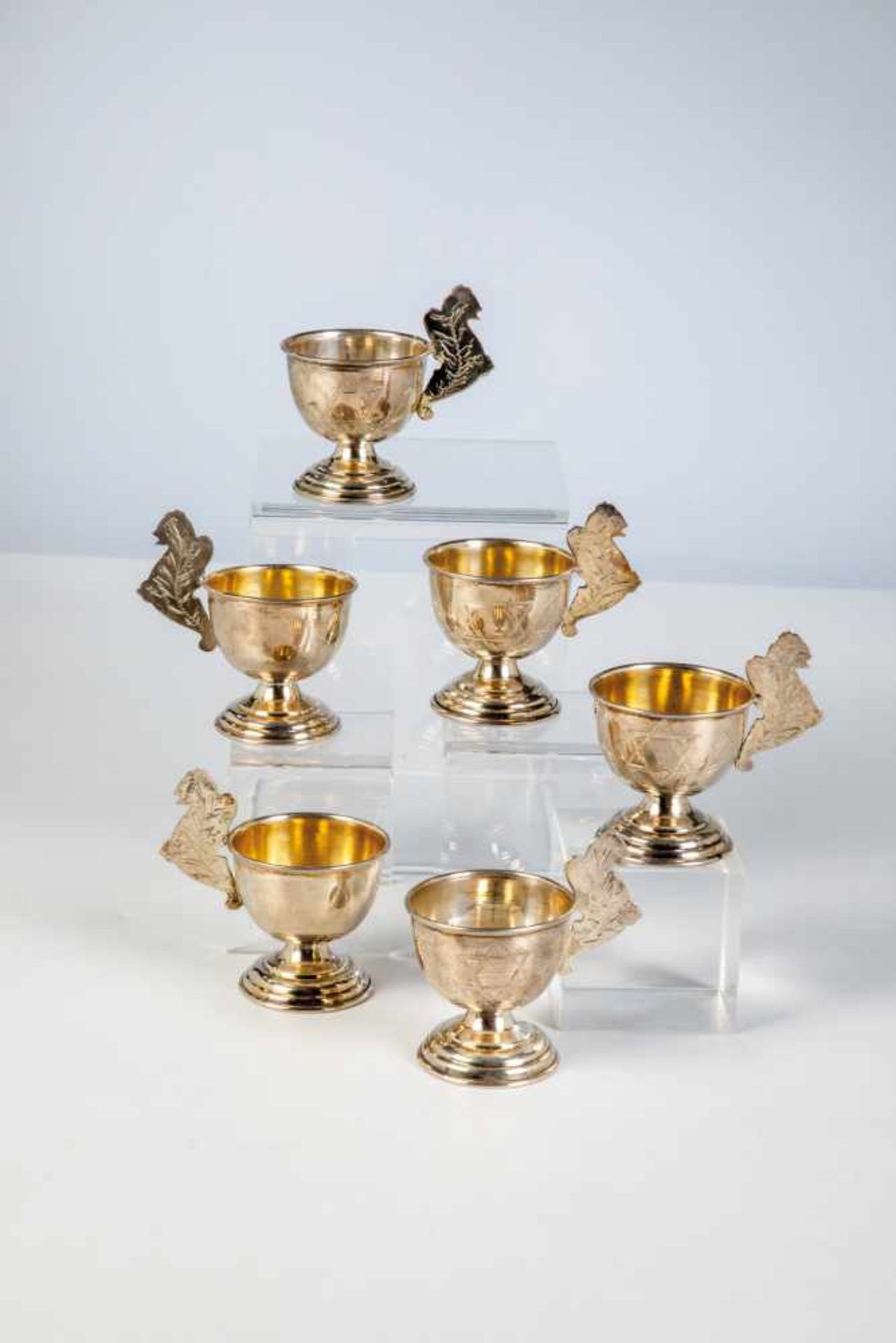 Six silver partial-gilt judaica beakers. 20th century. Four with gilt interior. Engravedstar of